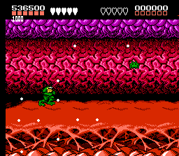 Battletoads (NES) screenshot: Turbo Tunnel, level 3-- space invaders come to take away your power bars; stop them before they succeed