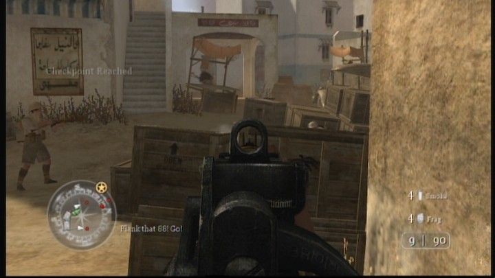 Call of Duty 2 (Xbox 360) screenshot: Shooting at enemy soldiers on the other side of the crates.