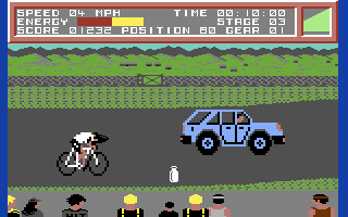 Milk Race (Commodore 64) screenshot: Don't get hit by cars!