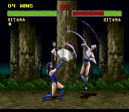 Mortal Kombat II (SNES) screenshot: Mysteriously hidden behind a tree, Smoke sees Kitana using the Fan Lift in her alter-ego.