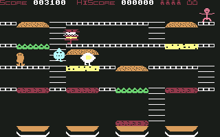 Mr. Wimpy: The Hamburger Game (Commodore 64) screenshot: The hamburger bun is about to squash the egg yolk