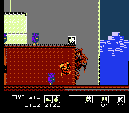 Karnov (NES) screenshot: Large faces plague the temple as well