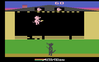 Oink! (Atari 2600) screenshot: Try to patch up the holes faster than the wolf creates them...