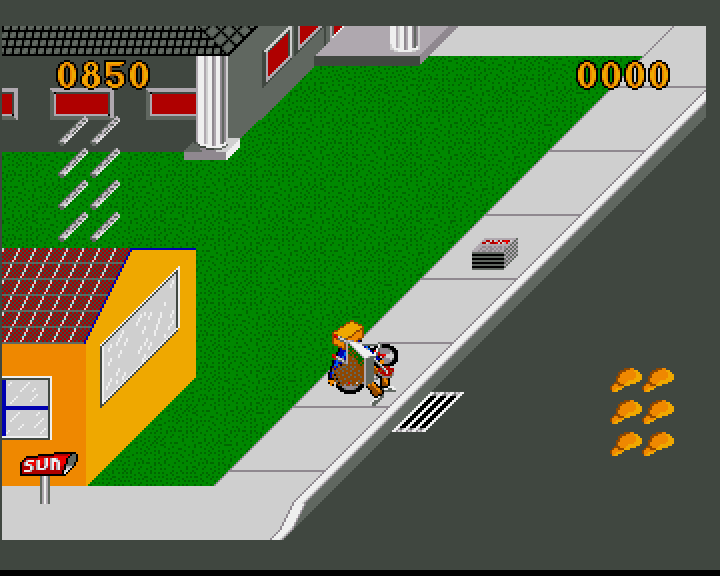 Paperboy (Amiga) screenshot: Warning: Tripping over a wheelbarrow in the middle of a footpath can be hazardous to your health