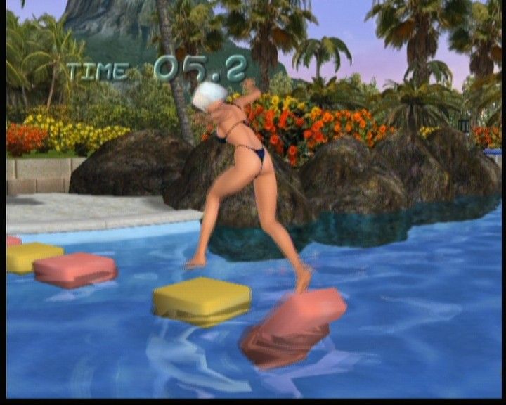 Dead or Alive: Xtreme Beach Volleyball (Xbox) screenshot: Christie playing the hopping game, the faster you get across, the more money you get... unless you hit the water.