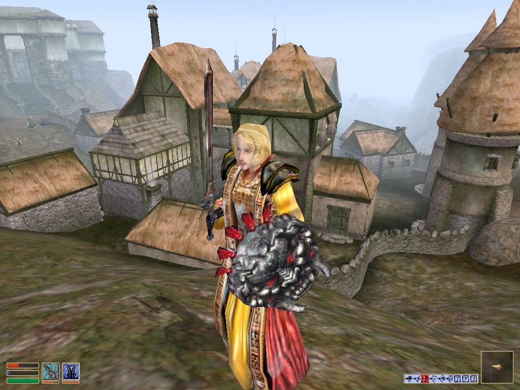 The Elder Scrolls III: Morrowind (Windows) screenshot: An experienced Morrowind heroine with magical cloak and enchanted sword in front of the mining town Caldera
