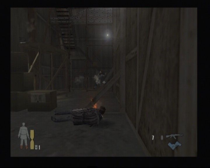 Max Payne 2: The Fall of Max Payne (PlayStation 2) screenshot: "A typical slow-motion slide and shoot" by Max Payne