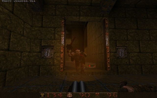 Quake (Windows) screenshot: Fighting an ogre - he throws grenades which can be pretty deadly