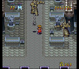Terranigma (SNES) screenshot: Angry-looking metallic guardians hit me with their S&M accessories in a castle dungeon