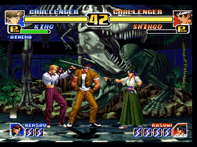 The King of Fighters '99: Millennium Battle (PlayStation) screenshot: Double team time! Shingo summons his striker Kasumi to perform an attack on King.