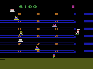 Cakewalk (Atari 2600) screenshot: Gingerbread men will sometimes move to the left.