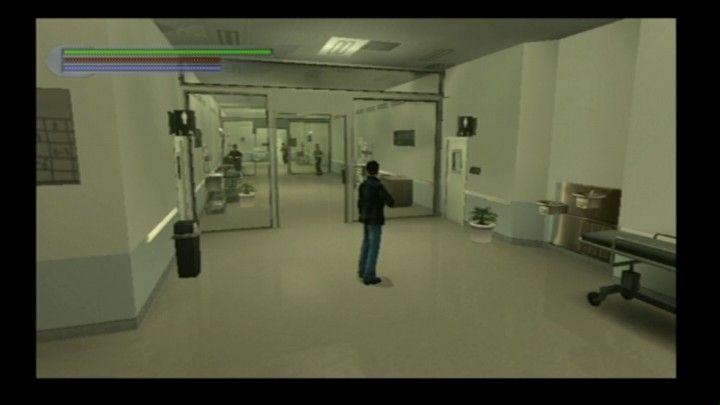 Jet Li: Rise to Honor (PlayStation 2) screenshot: There are lots of breakable items in the hospital, including those guys ahead.
