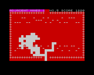 Mined-Out (ZX Spectrum) screenshot: This nasty bugger will relentlessly chase you until you get berserk. This was the case where either I was blown into pieces or smashed against the <i>Bug</i>.