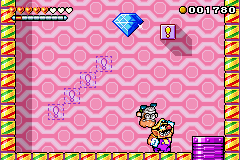 Wario Land 4 (Game Boy Advance) screenshot: Throwing an old man