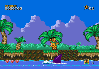 The Flintstones (Genesis) screenshot: The shark dig holes in the ground and tries to make you fall into the water