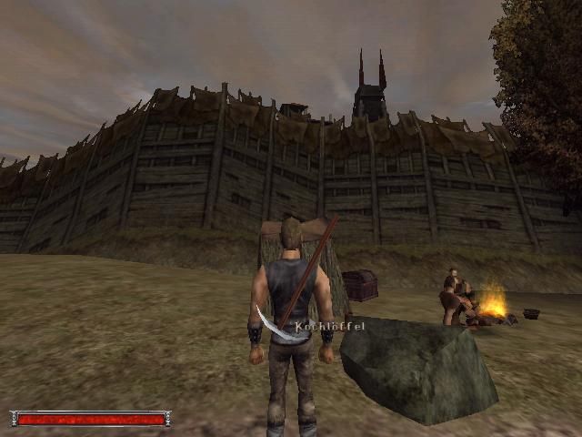 Gothic (Windows) screenshot: Outside the Old Camp. Note the character routines. The world in this game is hand-crafted with a lot of detail