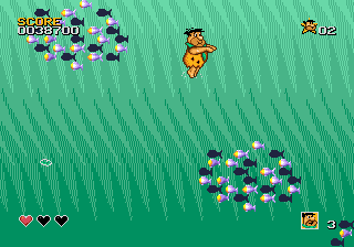 The Flintstones (Genesis) screenshot: Those fish are dangerous, since they can corner you to spikes