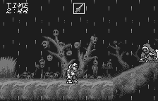 Makaimura for WonderSwan (WonderSwan) screenshot: It's raining, there are skulls growing on the trees, and a sad zombie approaches you. For some reason, you begin to see life in black colors