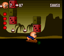 Porky Pig's Haunted Holiday (SNES) screenshot: Ducking to fit under low areas without falling off the carrot