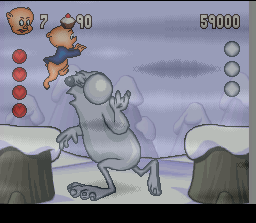 Porky Pig's Haunted Holiday (SNES) screenshot: Boss: Snowman: Jump on his head while he's bowling snow balls at Porky