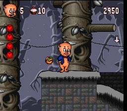 Porky Pig's Haunted Holiday (SNES) screenshot: By picking up a basket of fruit, Porky will have unlimited ammo to throw at this enemies