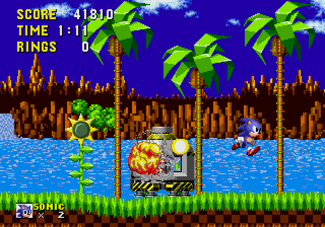 Sonic the Hedgehog (Genesis) screenshot: Destroying one of Eggman's capsules will free a bunch of animals.
