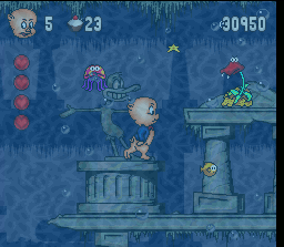 Porky Pig's Haunted Holiday (SNES) screenshot: Underwater - Looks like there's a shrine for Daffy here? Watch out for those stars shooting flower-thing