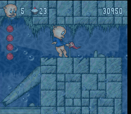 Porky Pig's Haunted Holiday (SNES) screenshot: When Porky reaches an "X" marked on the ground, he will put up a flag which will mark a restore spot.