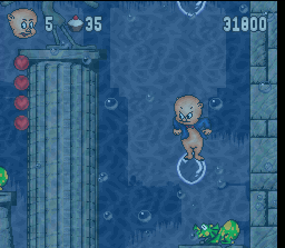 Porky Pig's Haunted Holiday (SNES) screenshot: Jumping on a balloon blown by that elephant-lizard-thing