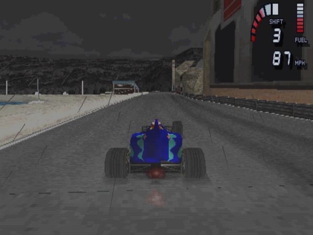 Formula 1 98 (PlayStation) screenshot: Down by the harbour in Monte Carlo<br>The car has only three wheels showing that F1 cars are not as robust as Arcade cars