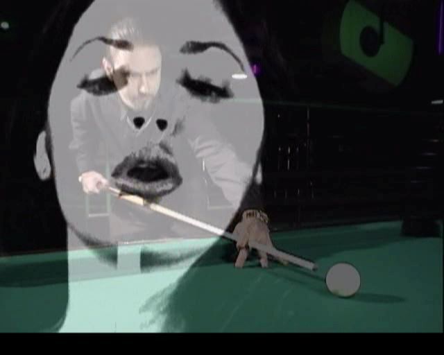 Q-Ball Billiards Master (PlayStation 2) screenshot: A shot from the video sequence shown at startup<br>This features two attractive ladies strutting around a pool table while this guy pots balls and looks mean-ish