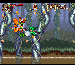 Disney's Magical Quest 3 starring Mickey & Donald (SNES) screenshot: "Booty bumping" his enemies while hanging.