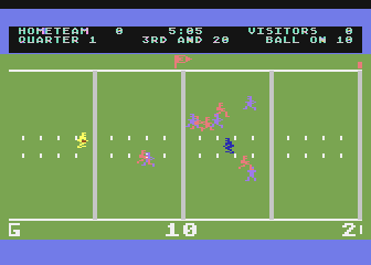 RealSports Football (Atari 8-bit) screenshot: The ball has been hiked and is in play.