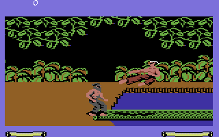 Fist: The Legend Continues (Commodore 64) screenshot: Attacking with a flying kick