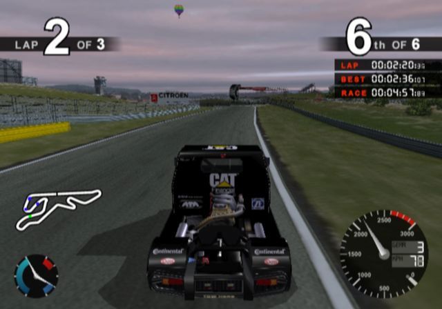 Super Trucks Racing (PlayStation 2) screenshot: If it's a racing game there has to be a hot air balloon somewhere<br>Other scenery features include light aircraft and flash photography from the stands
