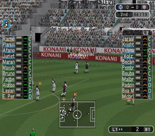 Pro Evolution Soccer: Management (PlayStation 2) screenshot: Here the camera angle has been changed to 'Broadcast' mode. The view now includes some crowd sections