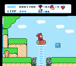Don Doko Don 2 (NES) screenshot: Riding a log on a waterfall