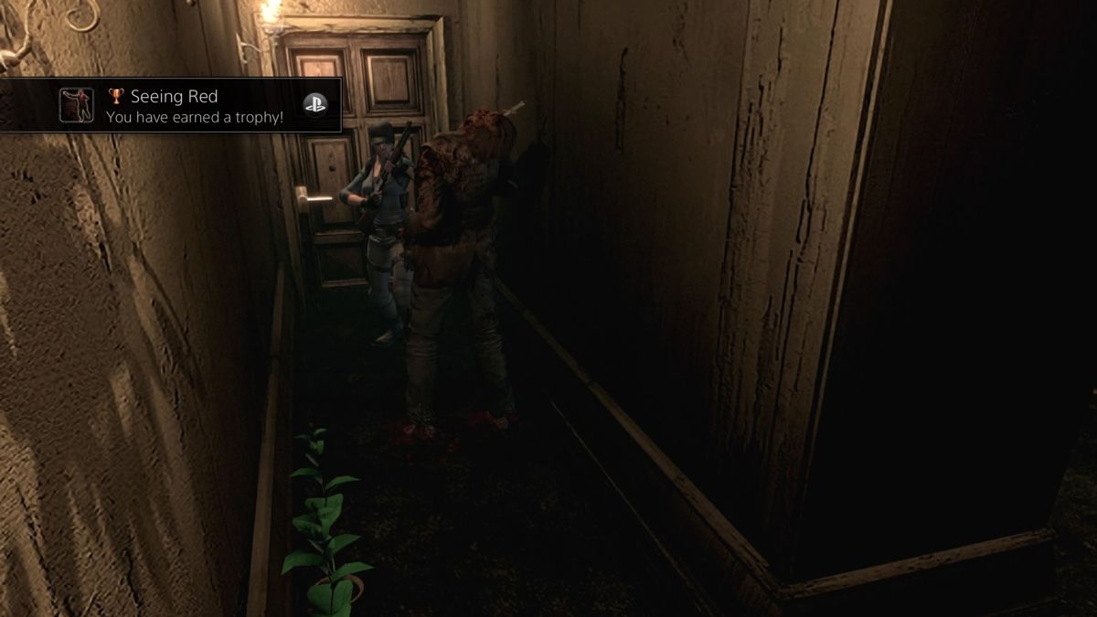 Resident Evil (PlayStation 4) screenshot: A knife to the head will buy you a few seconds to come to your senses
