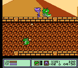 Widget (NES) screenshot: Stage 1 action in front of Australian desert pyramids
