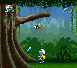 The Smurfs Travel the World (SNES) screenshot: Here is a crystal shard I need plus an enemy.