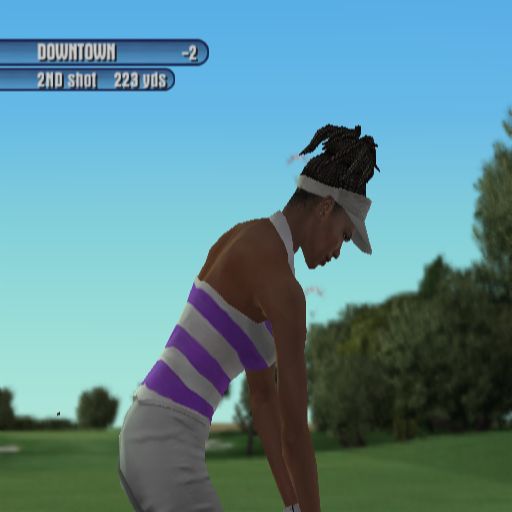 Tiger Woods PGA Tour 2003 (PlayStation 2) screenshot: The background is nicely out of focus here. Just behind the player are two paragliders, other shots have birds singly and in flocks and I'm sure i saw a deer among the trees on a Scottish course