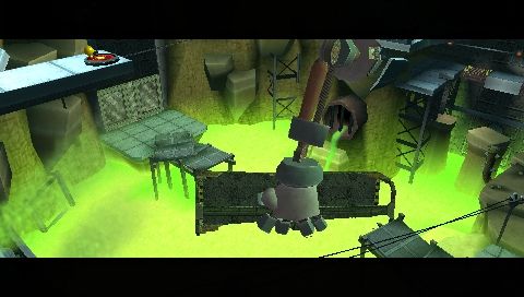 Pac-Man World 3 (PSP) screenshot: Big robot hand building bridge