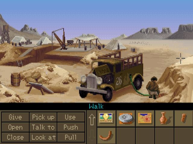 Indiana Jones and the Fate of Atlantis (Windows) screenshot: Borrowing some gasoline from the truck's reservoir (GOG version)