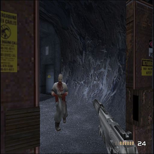 TimeSplitters 2 (PlayStation 2) screenshot: Playing in story mode. After fighting through the compound the player finally gets to meet their first zombies. They are very tough to kill