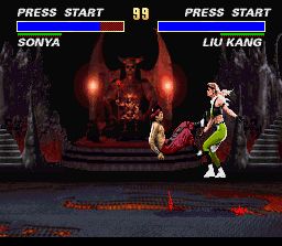Ultimate Mortal Kombat 3 (SNES) screenshot: Old favourite Liu Kang hits Sonya with his famous bicycle kick