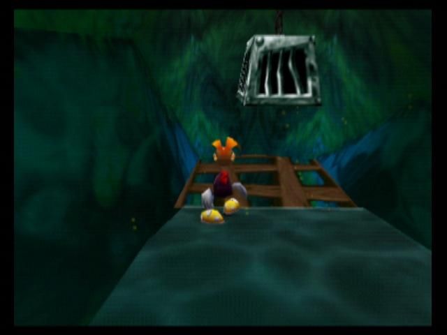 Rayman 2: The Great Escape (Nintendo 64) screenshot: Break open these cages to free Teensies and Lums