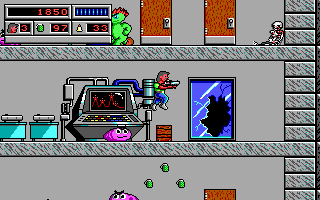 Bio Menace (DOS) screenshot: There are passages throughout the games which lead to interiors of levels or to other parts of the level. In this case a broken exterior window leads us inside this building.