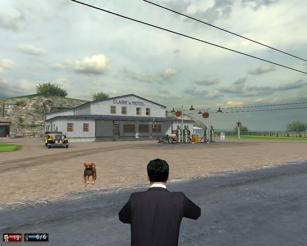 Mafia (Windows) screenshot: The missions will send you to various interesting places all over the city - and outside of it. Here, I'm attacked by a dog near a secluded motel