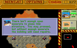 Dune II: The Building of a Dynasty (Amiga) screenshot: Without concrete slabs, your building will need repairs.