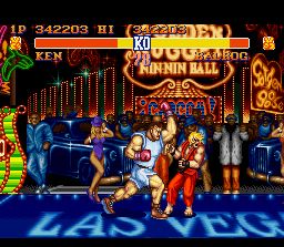 Street Fighter II (SNES) screenshot: Ken takes an uppercut on the chin from first boss Balrog
